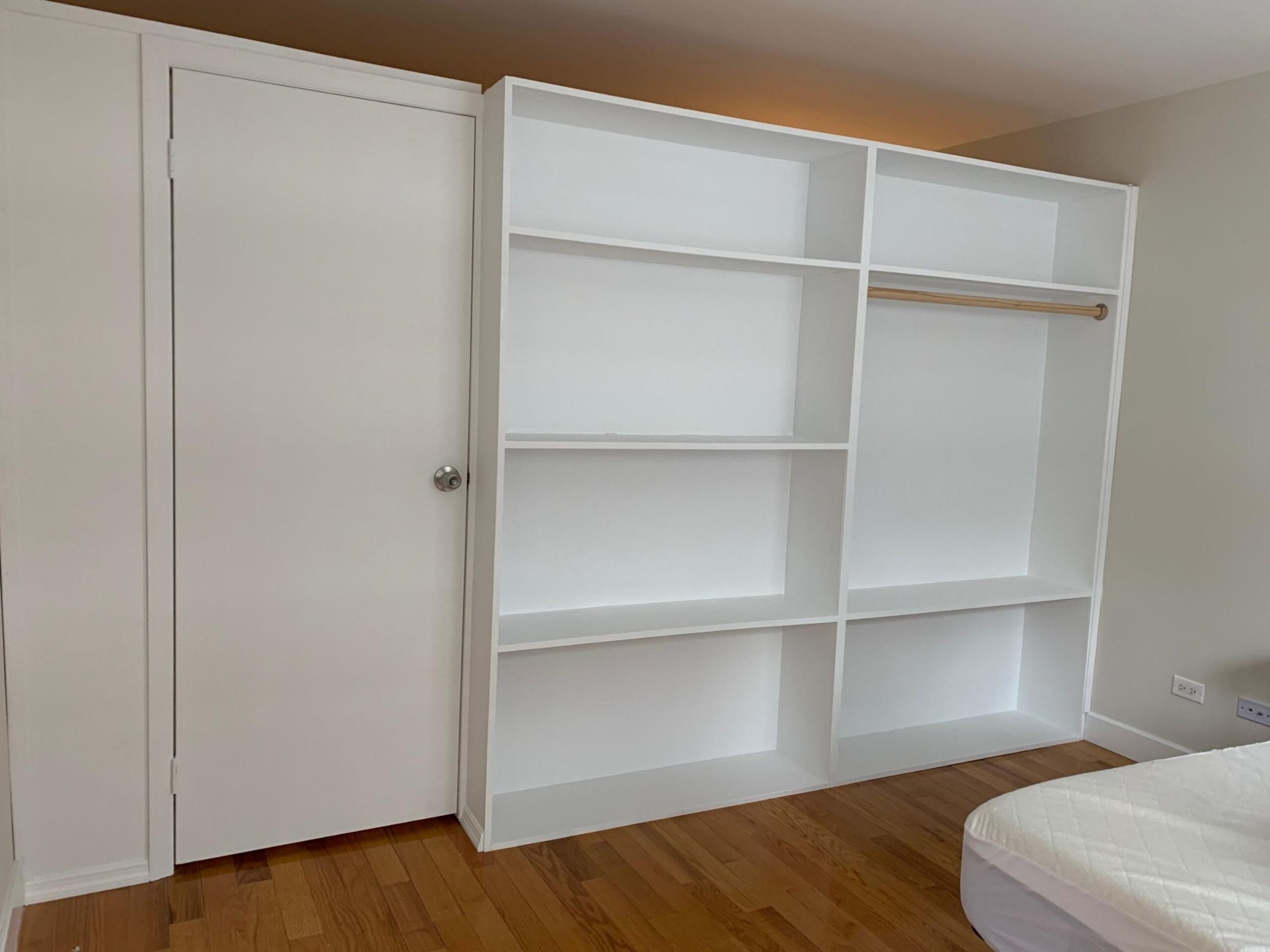 Bookcase wardrobe with swing door